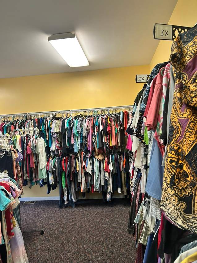 Clothing organized by size inside Kenny’s Kloset